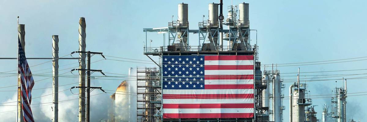 The US flag is displayed at the Wilmington Oil Fields south of Los Angeles, California on April 21, 2020.
