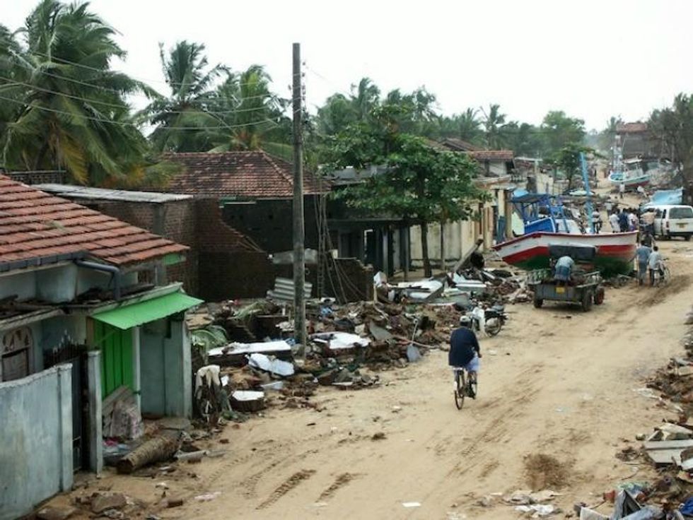 The village of Sainathimaruthu in eastern Sri Lanka was completely destroyed by the tsunami. Fisher families living along the coast faced another hurdle when the then Sri Lankan government initiated an ill-advised move to erect a 100-metre no-build buffer zone along the coast. The plan was later scrapped. (Photo: Amantha Perera/IPS)