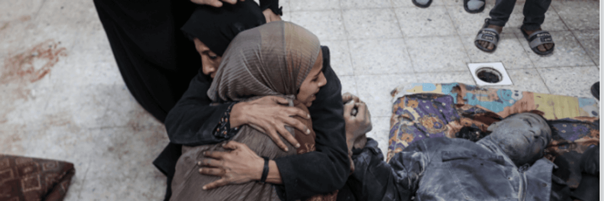 The wife and child of Qassem Elawawde mourn his murder in an Israeli strike last week.