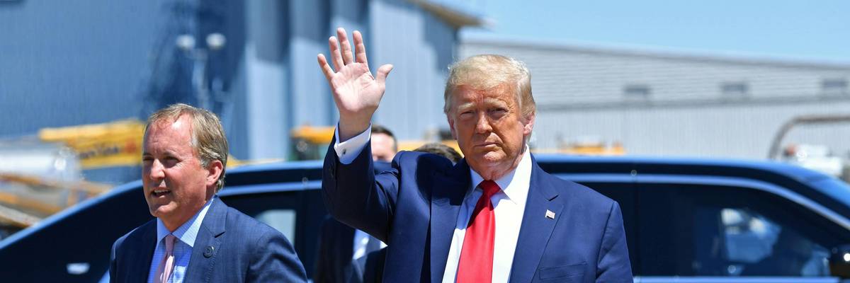 Then-President Donald Trump attends an event with Texas Attorney General Ken Paxton