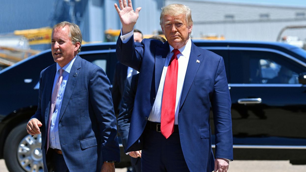 Then-President Donald Trump attends an event with Texas Attorney General Ken Paxton