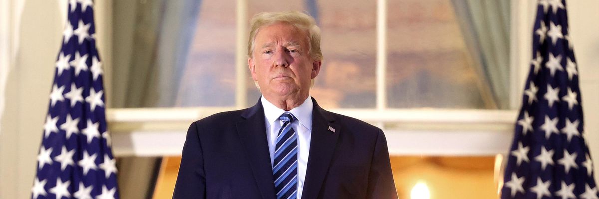 Then-President Donald Trump stands on the Truman Balcony after returning to the White House from Walter Reed National Military Medical Center on October 5, 2020 in Washington, D.C. (Photo: Win McNamee via Getty Images)