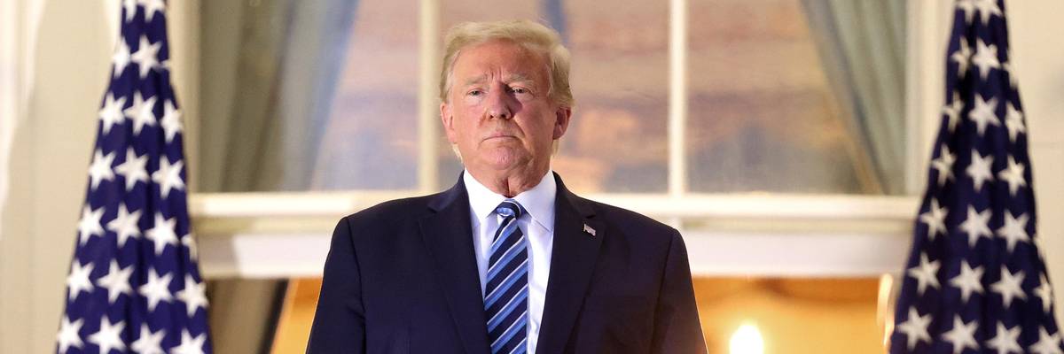 Then-President Donald Trump stands on the Truman Balcony after returning to the White House from Walter Reed National Military Medical Center on October 5, 2020 in Washington, D.C. (Photo: Win McNamee via Getty Images)