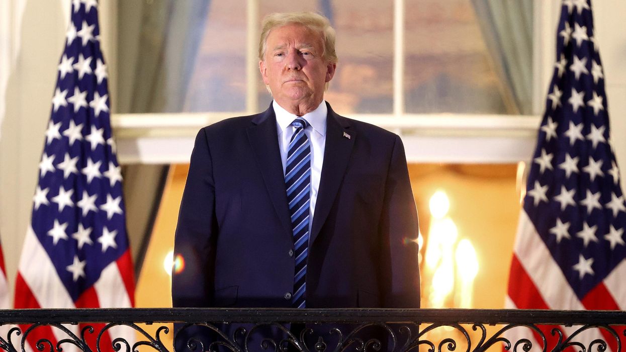 Then-President Donald Trump stands on the Truman Balcony after returning to the White House from Walter Reed National Military Medical Center on October 5, 2020 in Washington, D.C. (Photo: Win McNamee via Getty Images)