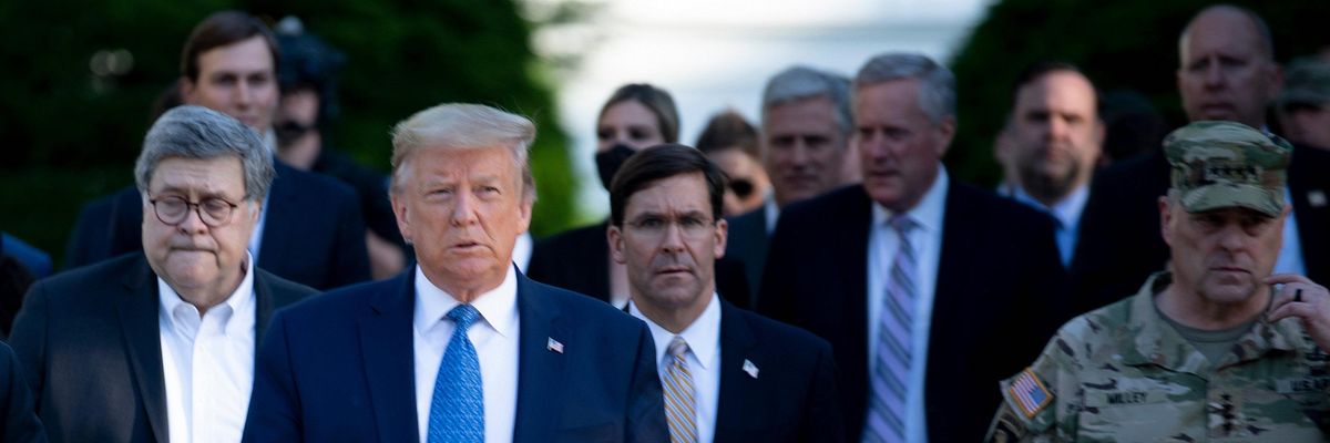 Then-President Donald Trump walks with U.S. Attorney General William Barr (L), Secretary of Defense Mark T. Esper (C), Chairman of the Joint Chiefs of Staff Mark A. Milley (R), and others from the White House to visit St. John's Church after the area was cleared of people protesting the death of George Floyd June 1, 2020, in Washington, DC. (Photo: Brendan Smialowski/AFP via Getty Images)