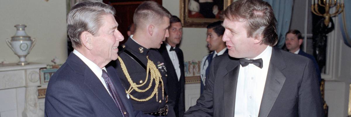 Then-President Ronald Reagan and Donald Trump shake hands in 1987.