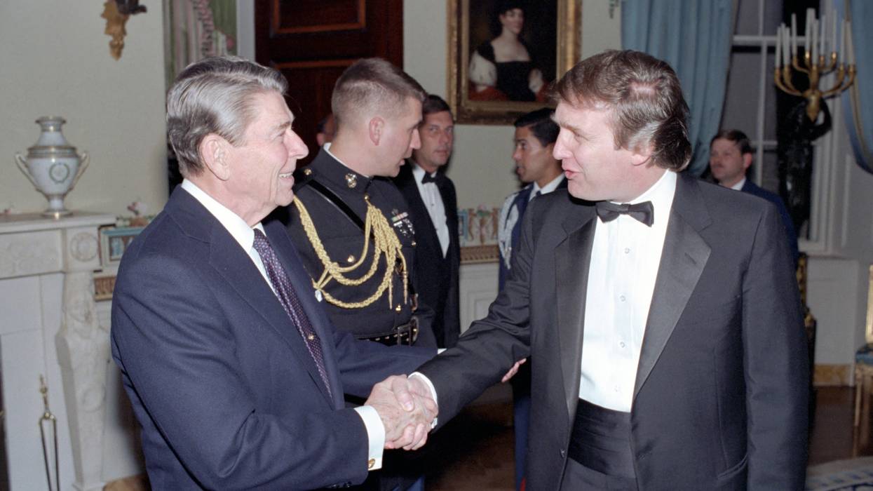Then-President Ronald Reagan and Donald Trump shake hands in 1987.