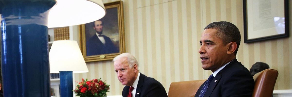 Then-U.S. President Barack Obama and then-U.S. Vice President Joe Biden discuss the Trans-Pacific Partnership with Cabinet members at the White House in Washington, D.C. on December 16, 2013.