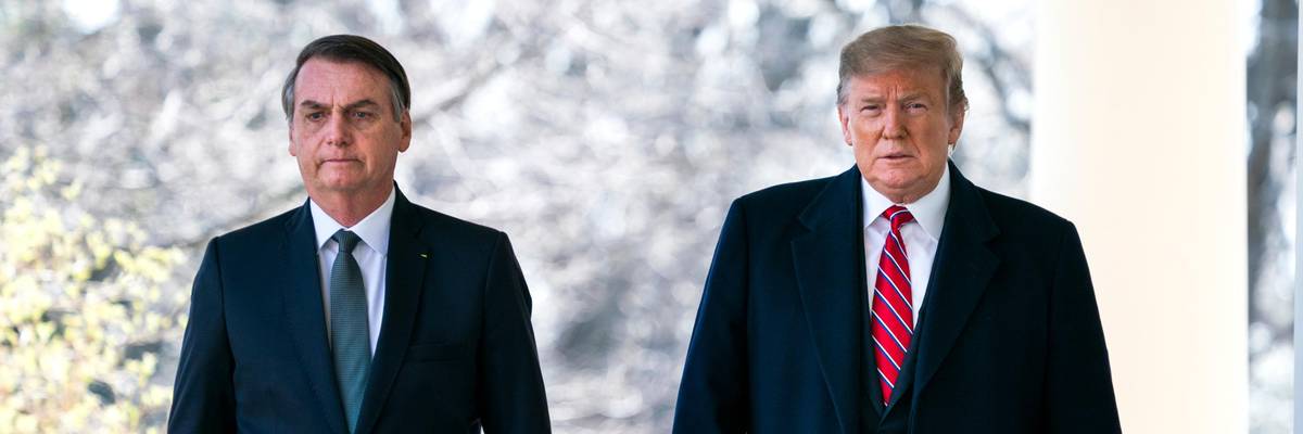 Then-U.S. President Donald Trump walks with Brazilian President Jair Bolsonaro