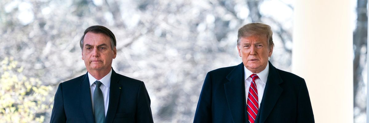 Then-U.S. President Donald Trump walks with Brazilian President Jair Bolsonaro