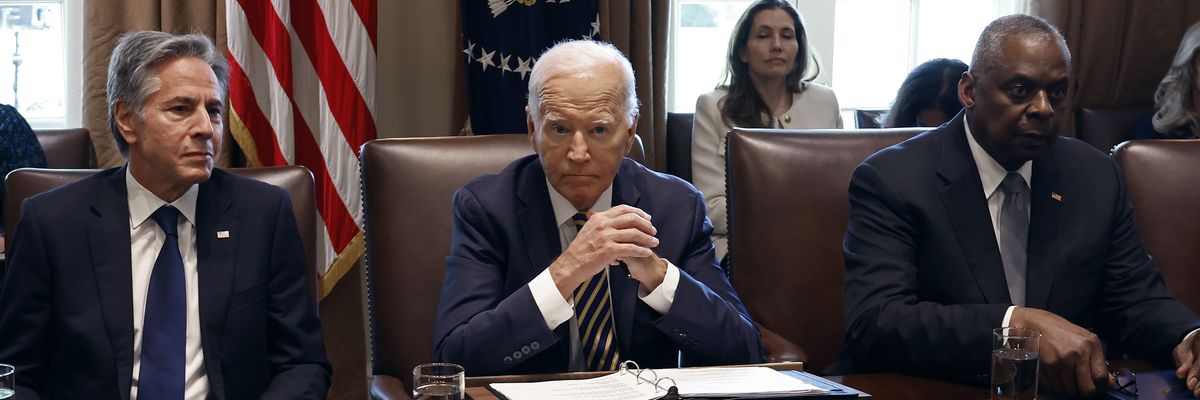 Then-U.S. President Joe Biden presided over a Cabinet meeting, flanked by Secretary of State Antony Blinken and Defense Secretary Lloyd Austin