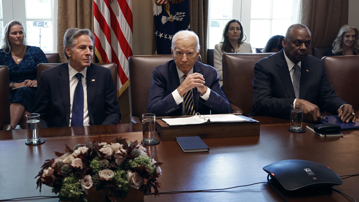 Then-U.S. President Joe Biden presided over a Cabinet meeting, flanked by Secretary of State Antony Blinken and Defense Secretary Lloyd Austin