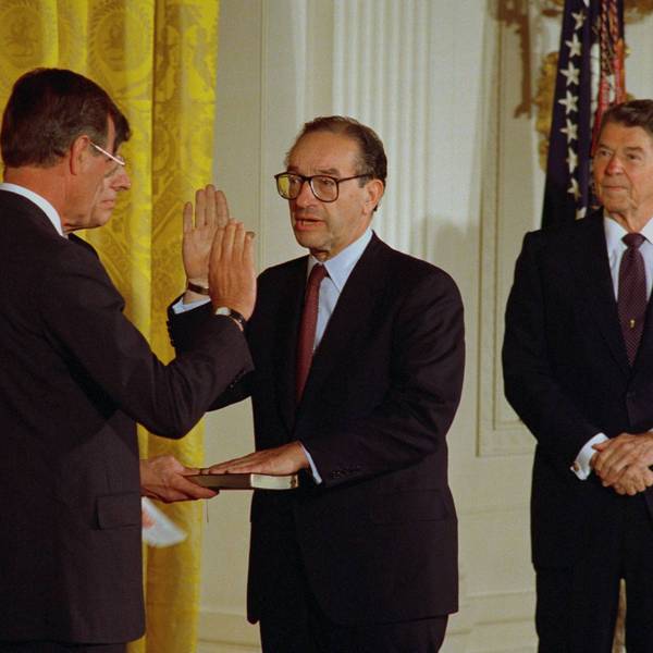 Then-Vice President George H. W. Bush swears in Alan Greenspan while President Ronald Reagan looks on.