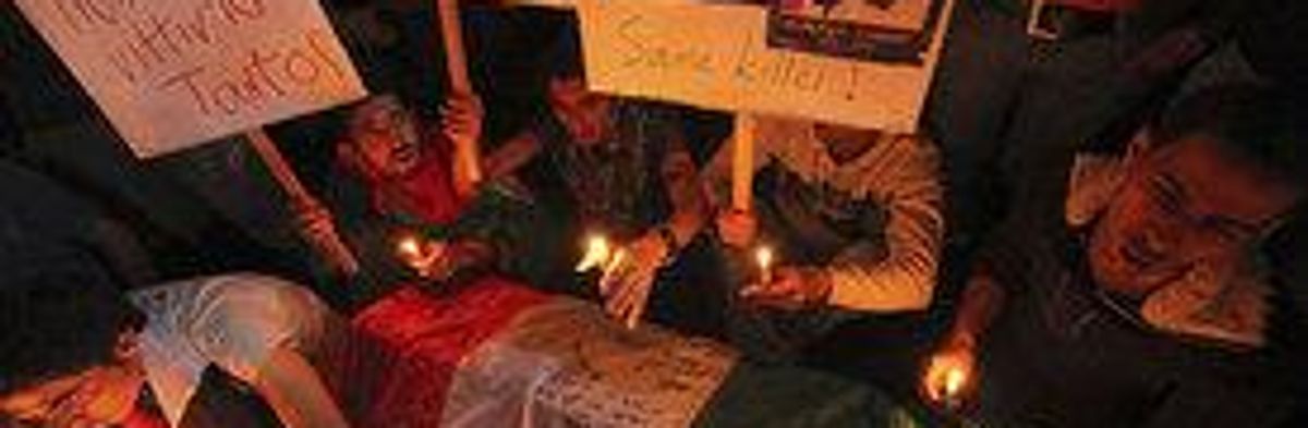 Candlelight Vigil Held for Italian Activist