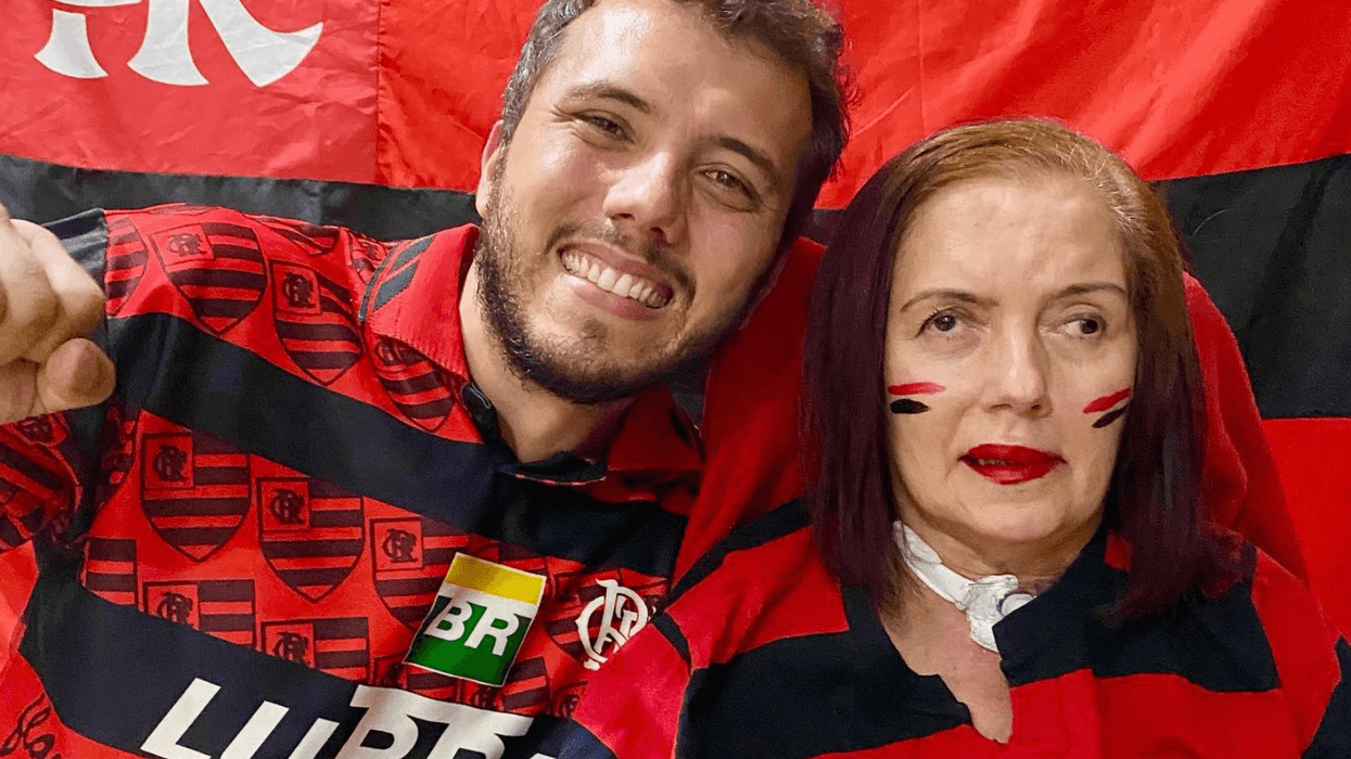 Thiago Avila and his mother, Teresa Regina de Ávila e Silva, decked out in gear supporting the soccer team Flamengo