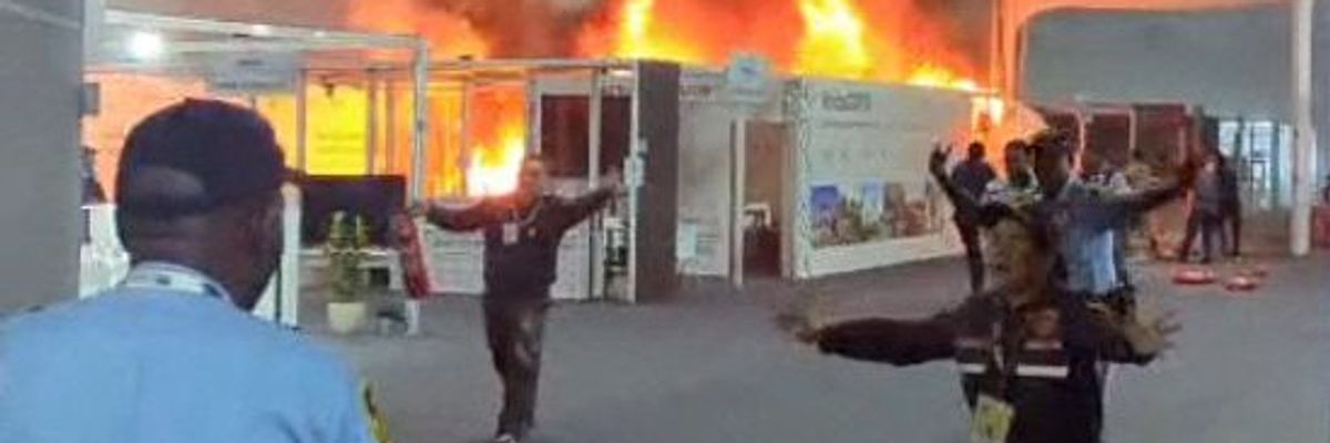 'Potent Metaphor': Fire Forces Evacuation of UN Climate Conference