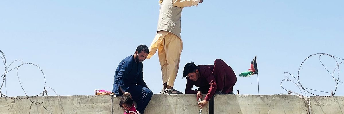 Thousands of Afghans rush to the Hamid Karzai International Airport as they try to flee the capital of Kabul, Afghanistan on August 16, 2021. (Photo: Haroon Sabawoon/Anadolu Agency via Getty Images)