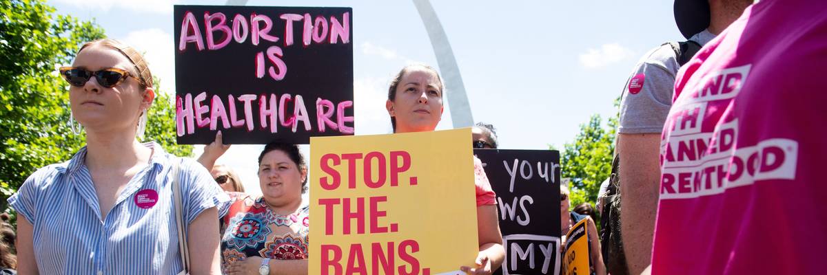 Thousands of demonstrators march in support of Planned Parenthood and abortion rights