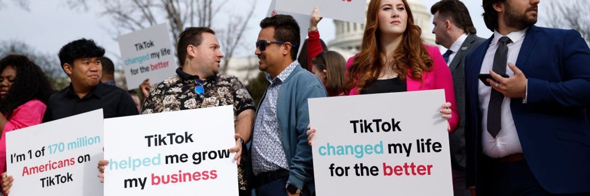 TikTok users protest against a ban on the popular social media site outside the U.S. Capitol.