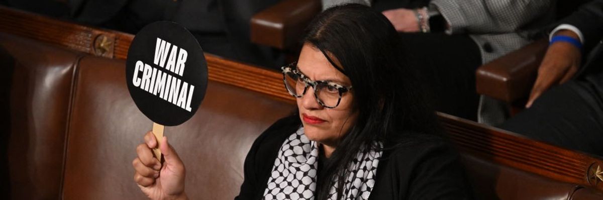 Tlaib holds sign that says "War Criminal" during Netanyahu speech to Congress