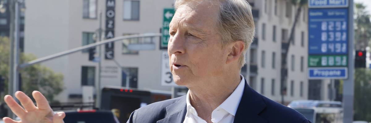 Tom Steyer campaigns in front of a gas station selling gasoline for over $8/gallon