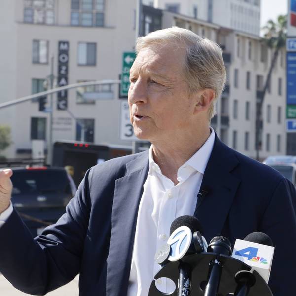 Tom Steyer campaigns in front of a gas station selling gasoline for over $8/gallon
