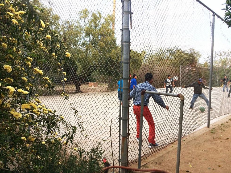 Top, children make use of the vast monastery grounds during Tucson's temperate days of spring. Above, guests start a game of pick-up soccer in the ball court after dinner. (Photo: Rose Lambert-Sluder)