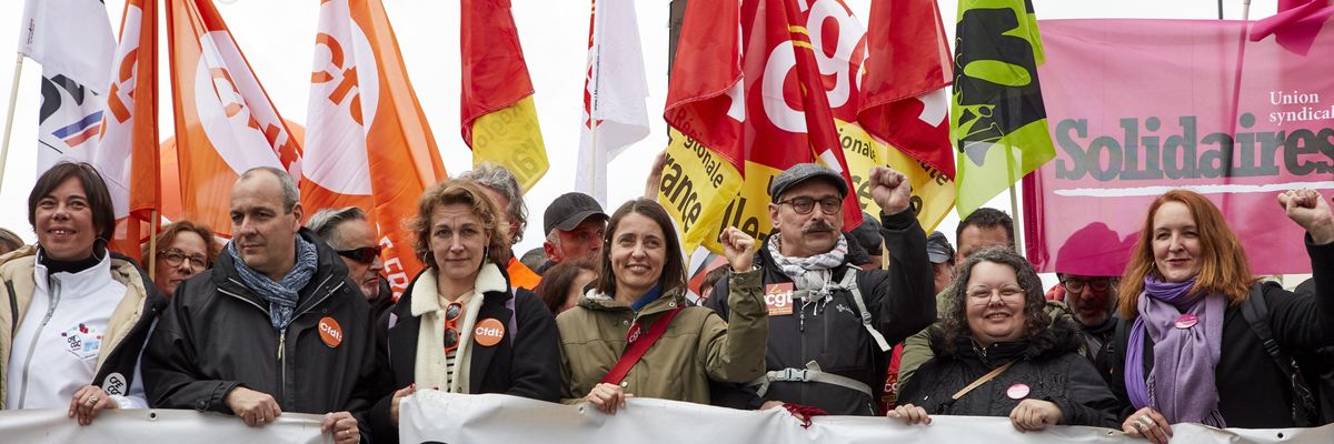 Trade union leaders march in Paris on April 6, 2023 to protest French President Emmanuel Macron's attack on the country's pension system.