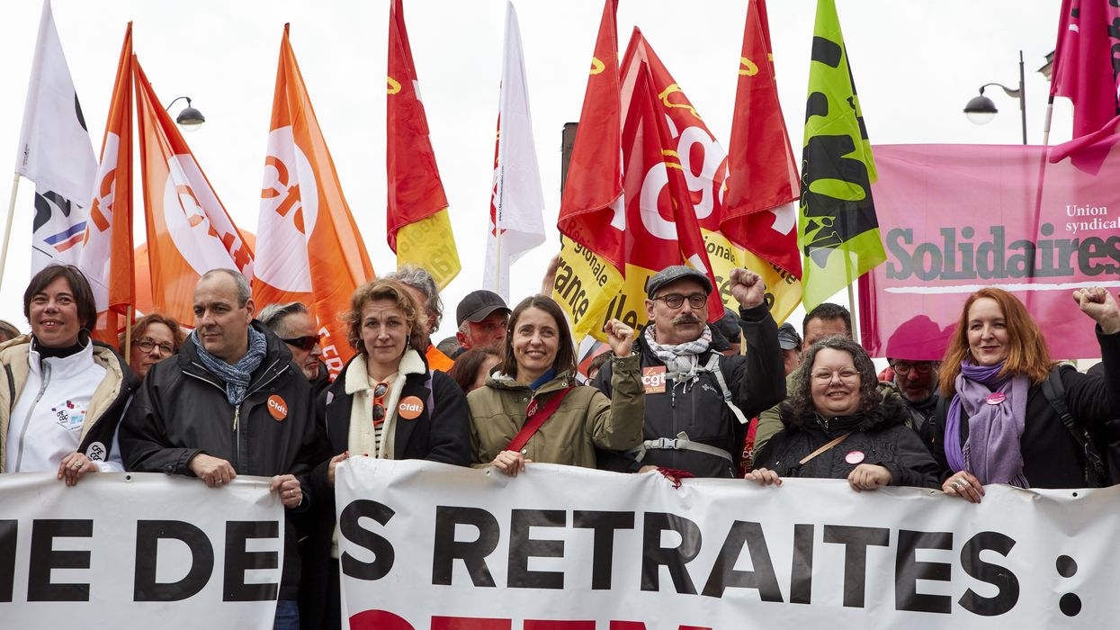 Trade union leaders march in Paris on April 6, 2023 to protest French President Emmanuel Macron's attack on the country's pension system.