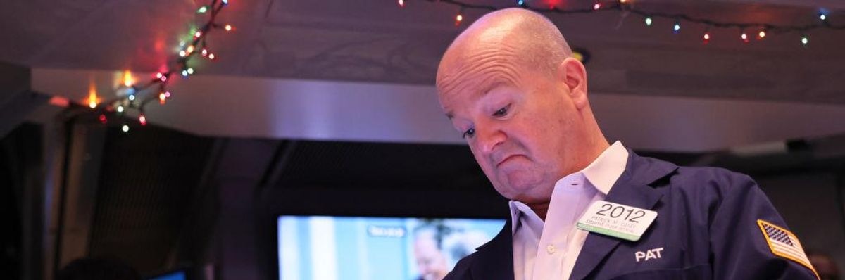Traders work on the floor of the New York Stock Exchange