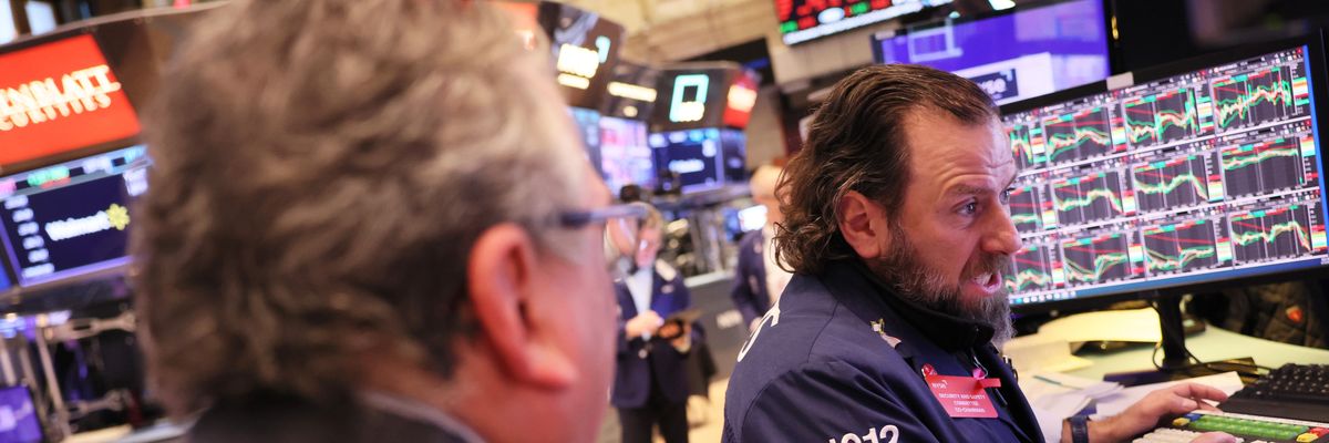 Traders work on the floor of the New York Stock Exchange
