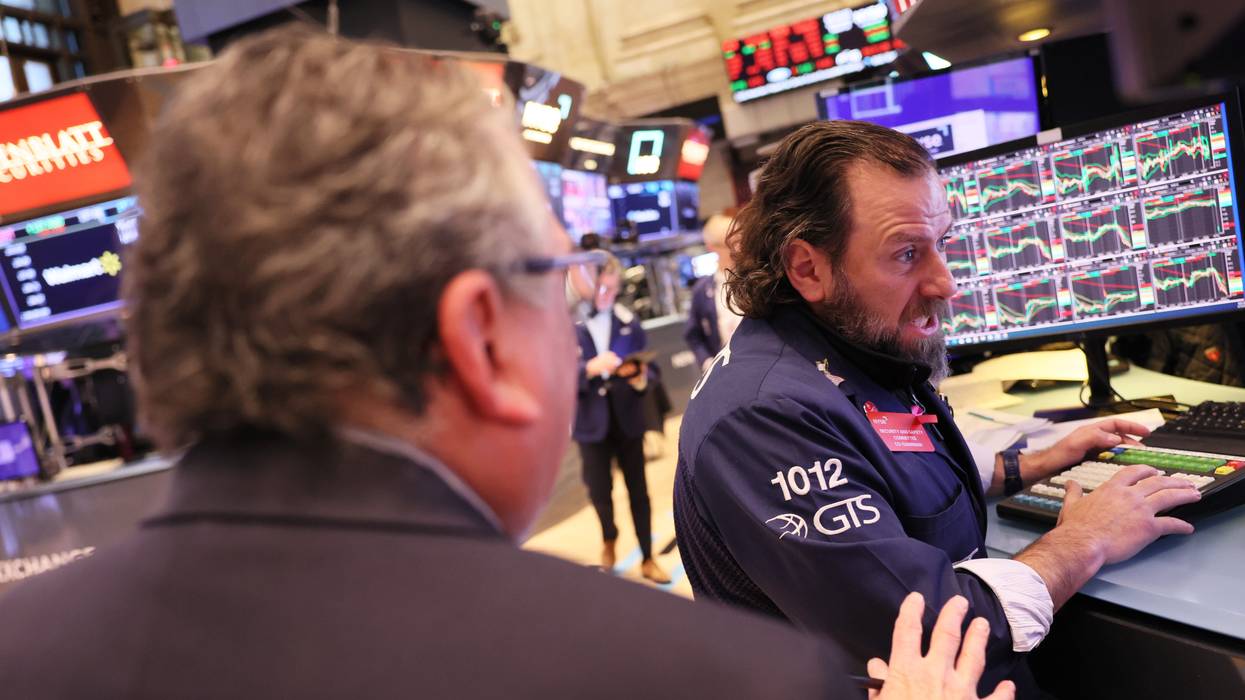 Traders work on the floor of the New York Stock Exchange