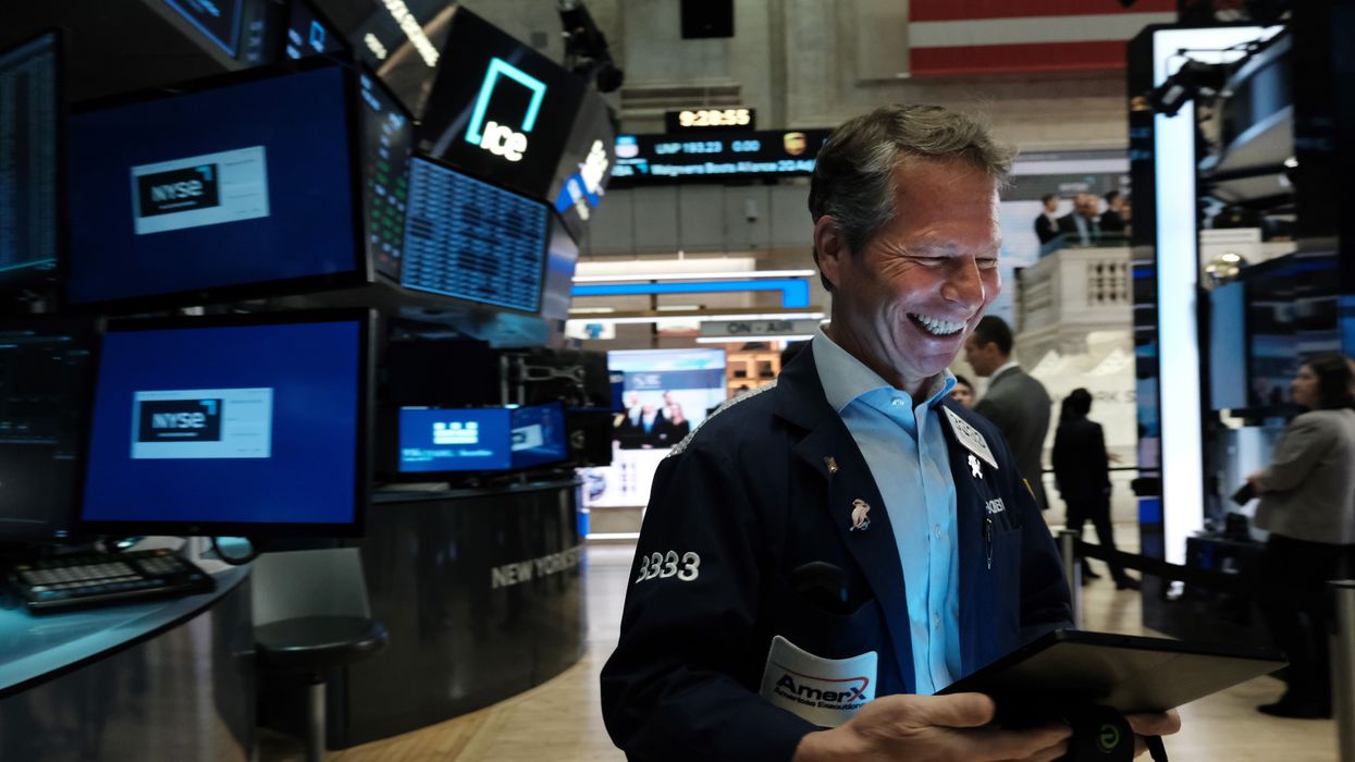 Traders work on the floor of the New York Stock Exchange