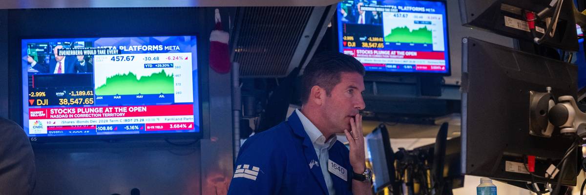Traders work on the floor of the New York Stock Exchange