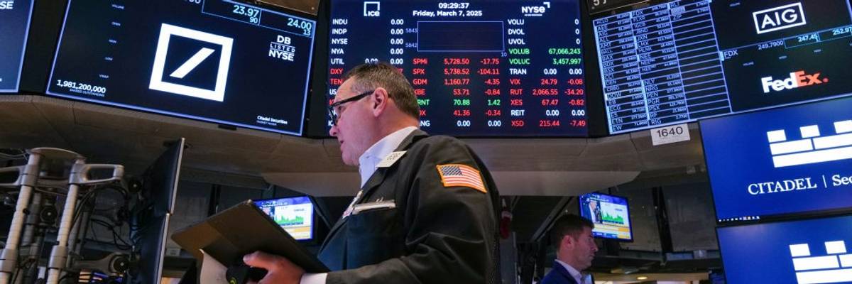 Traders work on the floor of the New York Stock Exchange