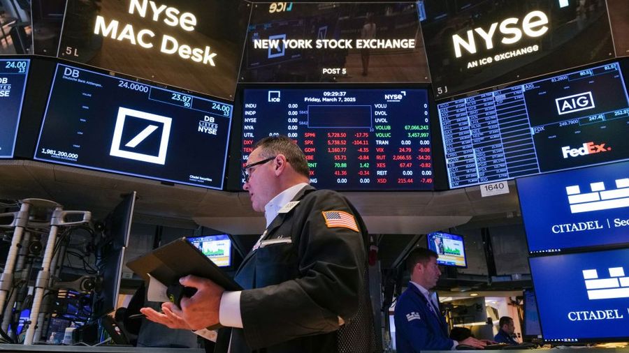 Traders work on the floor of the New York Stock Exchange