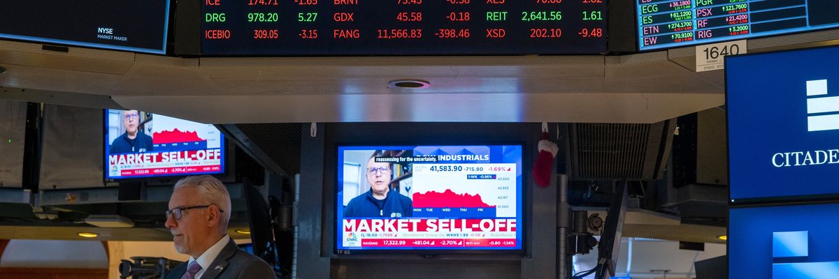 Traders work on the floor of the New York Stock Exchange