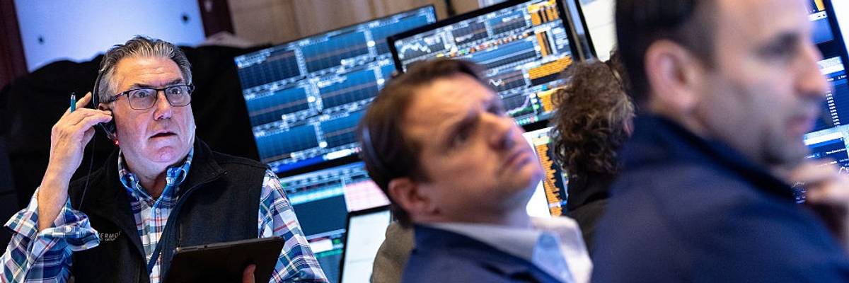 Traders work on the floor of the New York Stock Exchange