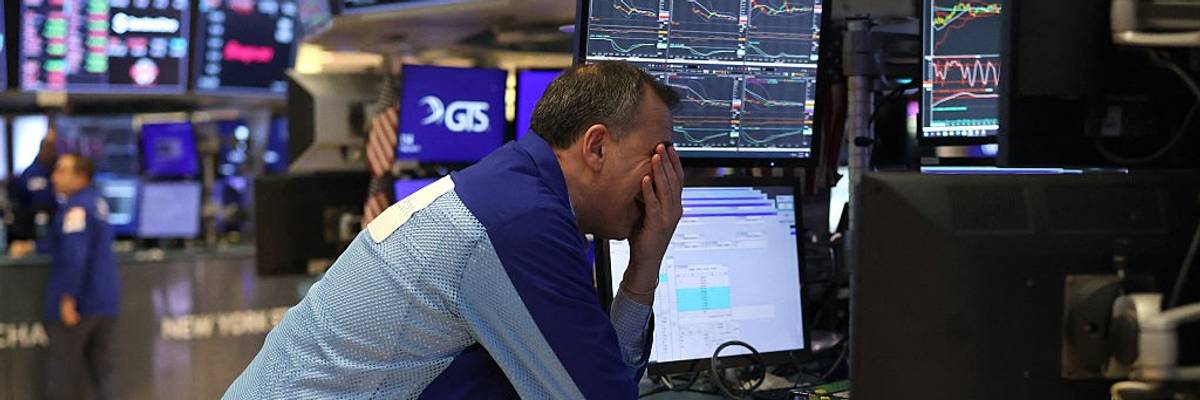 Traders work on the floor of the New York Stock Exchange