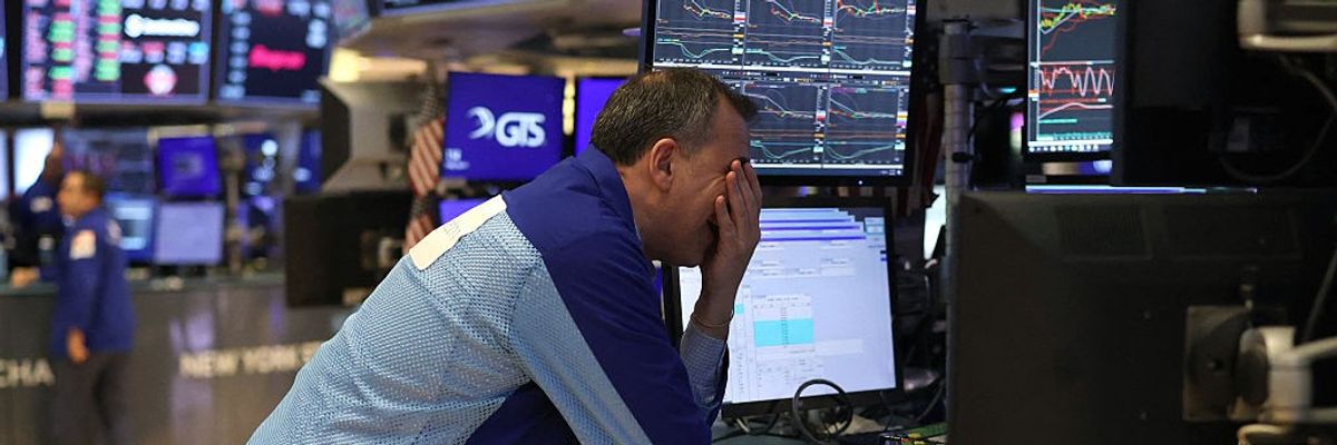 Traders work on the floor of the New York Stock Exchange