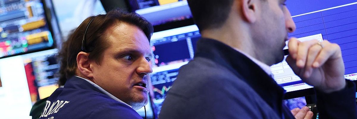 Traders work on the floor of the New York Stock Exchange