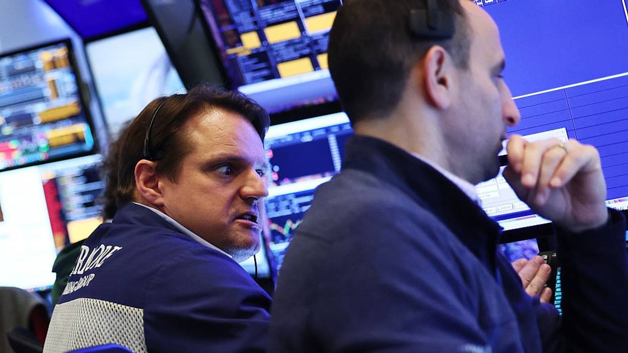 Traders work on the floor of the New York Stock Exchange