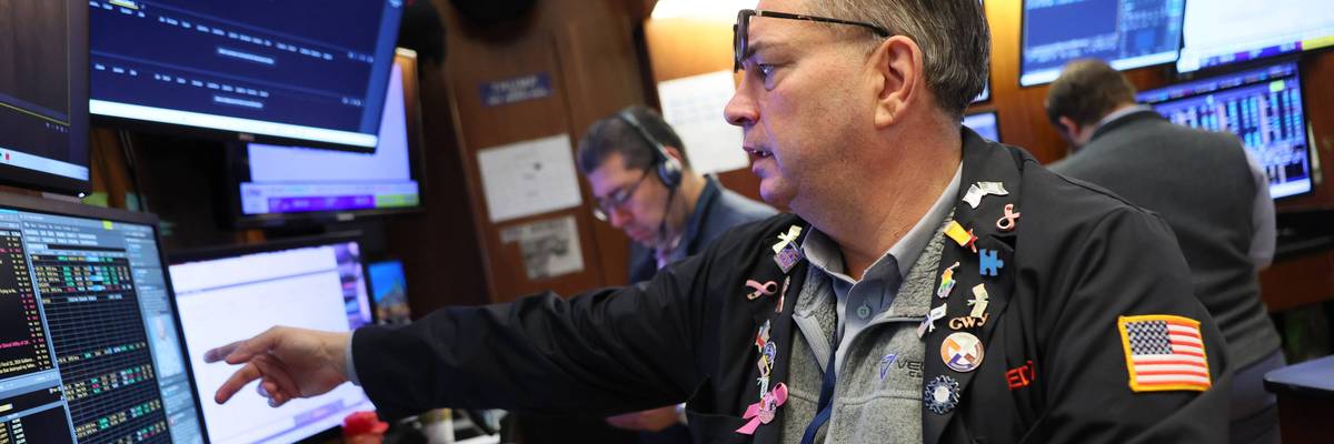 Traders work on the floor of the New York Stock Exchange