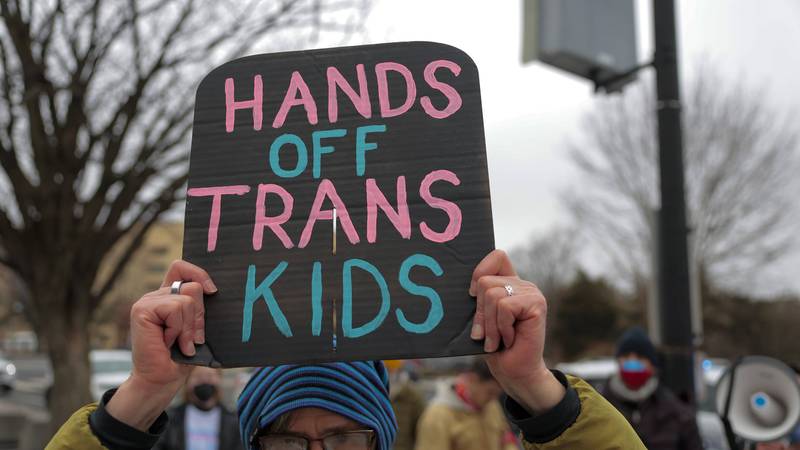 Transgender Rights Supporters Protest Outside HHS Headquarters In Washington DC