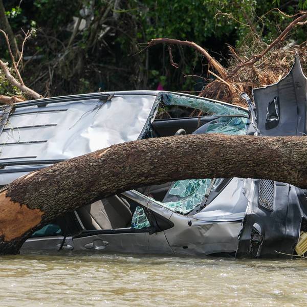 Travis County Flood recovery - Destroyed vehicles sit in flood waters