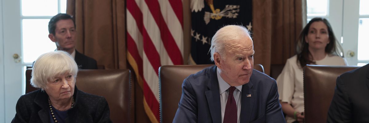 Treasury Secretary Janet Yellen listens as President Joe Biden speaks to reporters before the start of a cabinet meeting on March 3, 2022 in Washington, D.C.