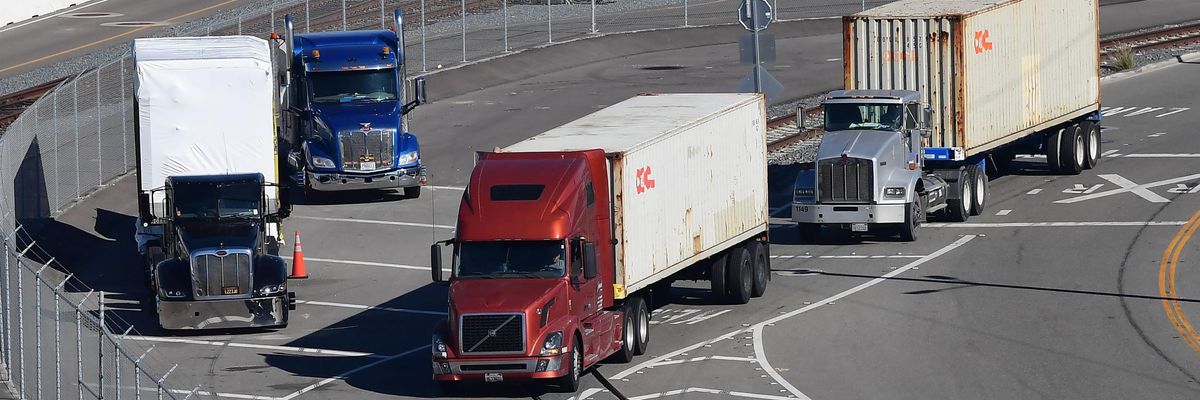 Trucks drive to port of Long Beach, California. 