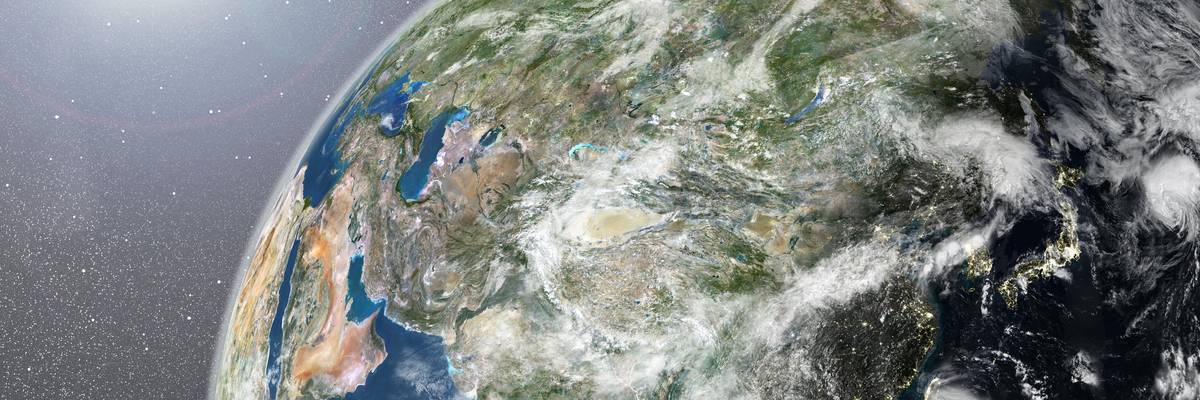 True colour satellite image of the Earth showing Asia, half in shadow, with cloud coverage, and the sun. This image in orthographic projection was compiled from data acquired by LANDSAT 5 & 7 satellites., Globe Showing Asia, True Colour Satellite Image (Photo by Planet Observer/Universal Images Group via Getty Images)