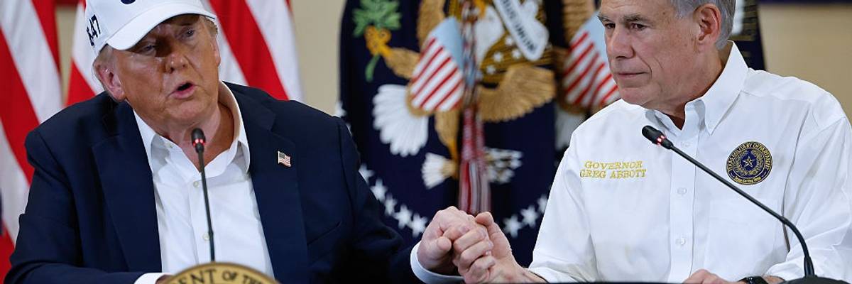 Trump and Abbott hold hands.