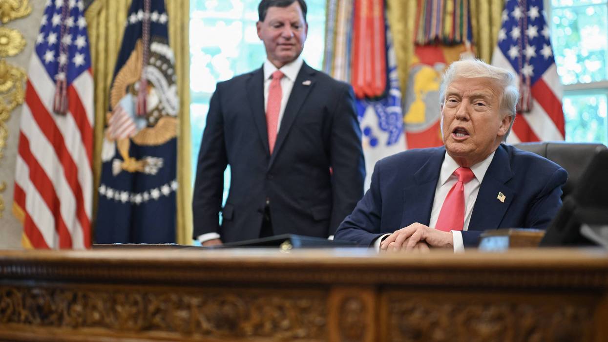 Trump and Bisignano in the Oval Office.